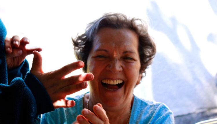 woman in blue shirt smiling